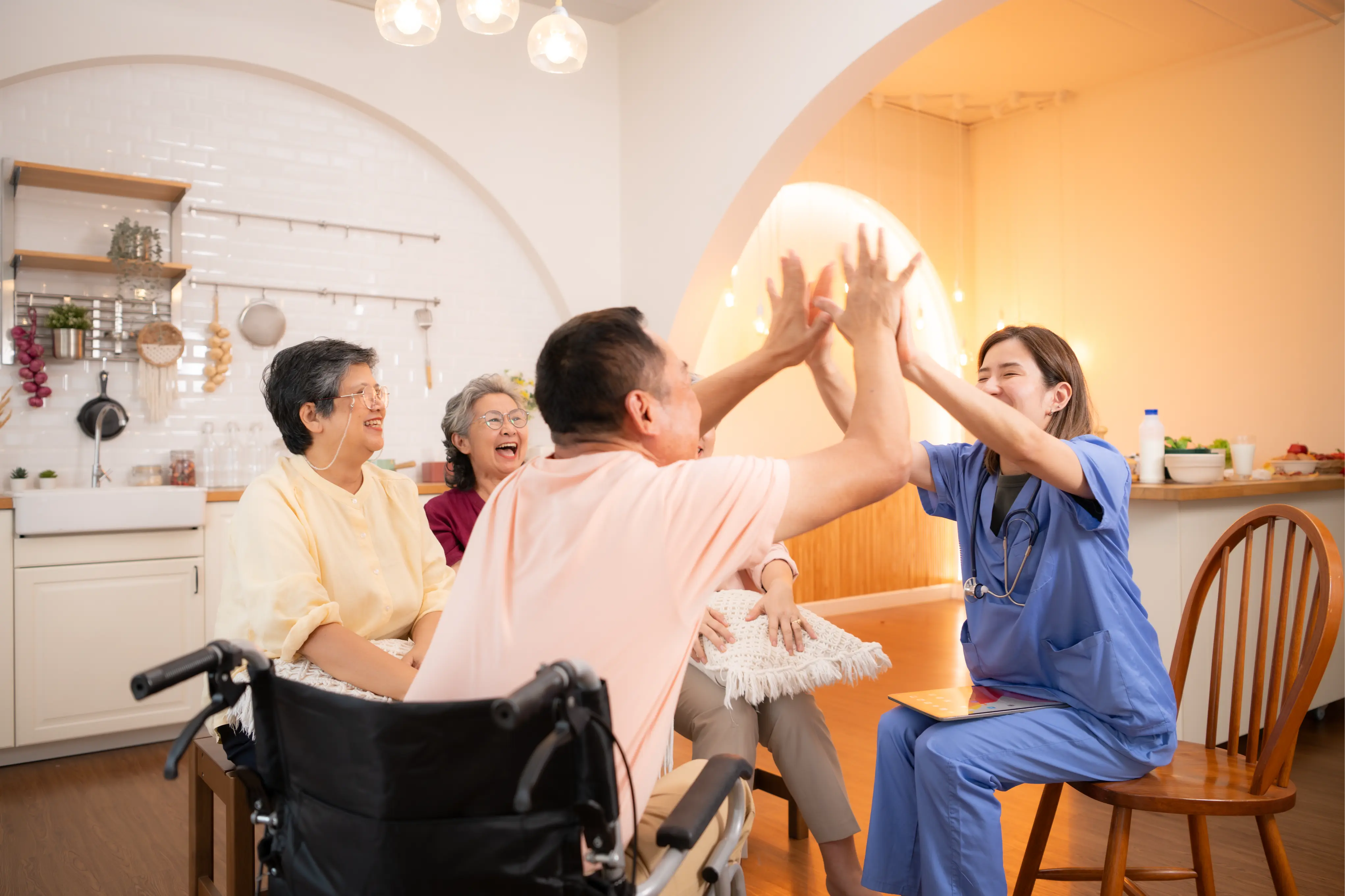 High Support Care team member smiling with an elderly care recipient in a park